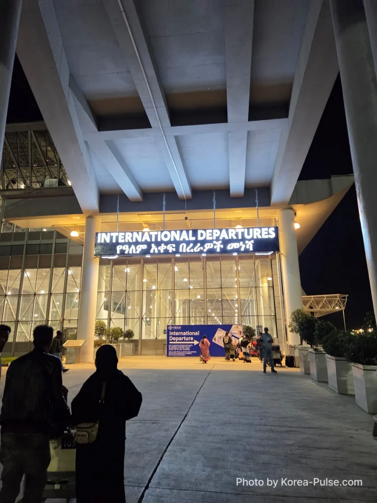 BTS Is Back: A Global Dad's Perspective from the Heart of Seoul 3 International departures sign at an Ethiopian airport