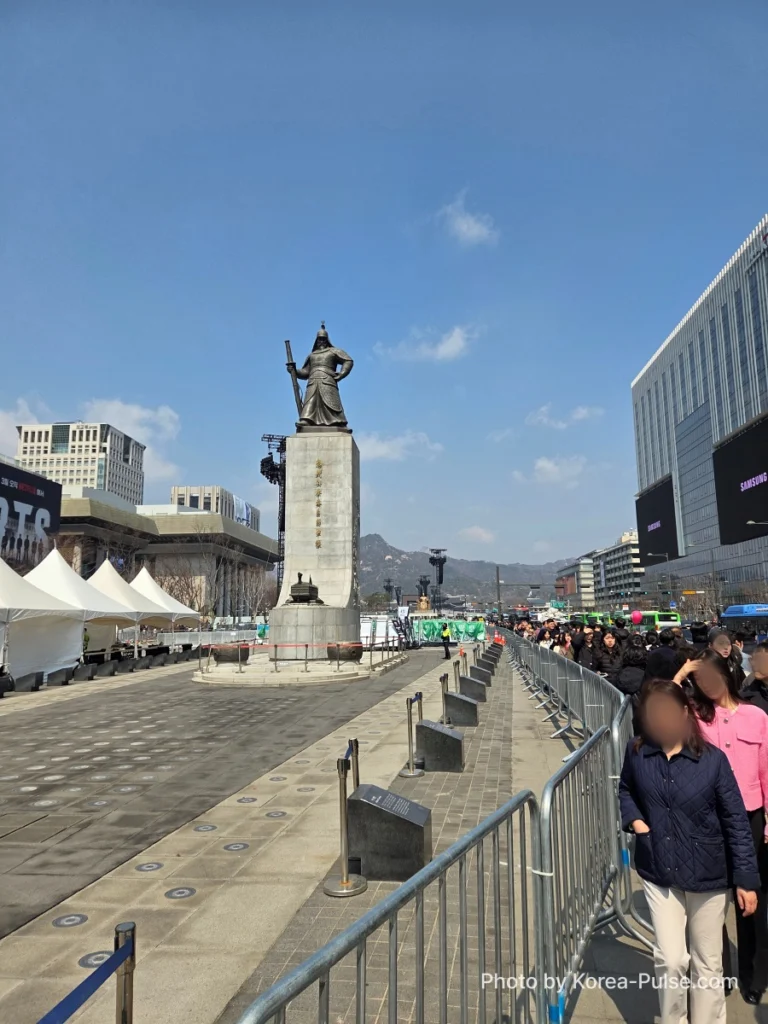 BTS Is Back: A Global Dad's Perspective from the Heart of Seoul 7 Gwanghwamun Square with the Admiral Yi Sun-sin statue and crowds gathering behind barricades ahead of the BTS showcase