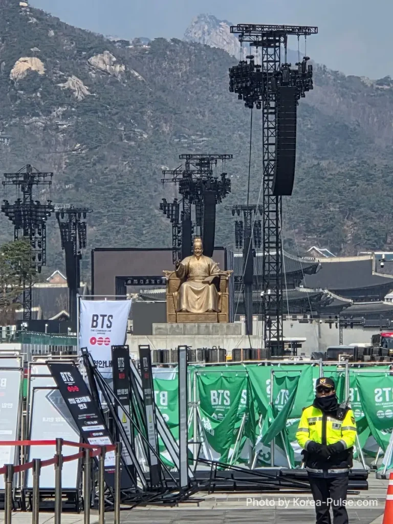 BTS Is Back: A Global Dad's Perspective from the Heart of Seoul 6 A police officer standing in front of the BTS comeback showcase site