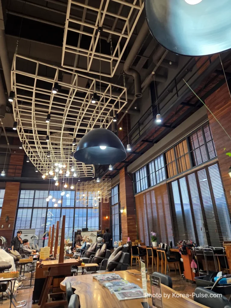 Window-side seating area at idHAIR One Mount with natural light and open salon floor