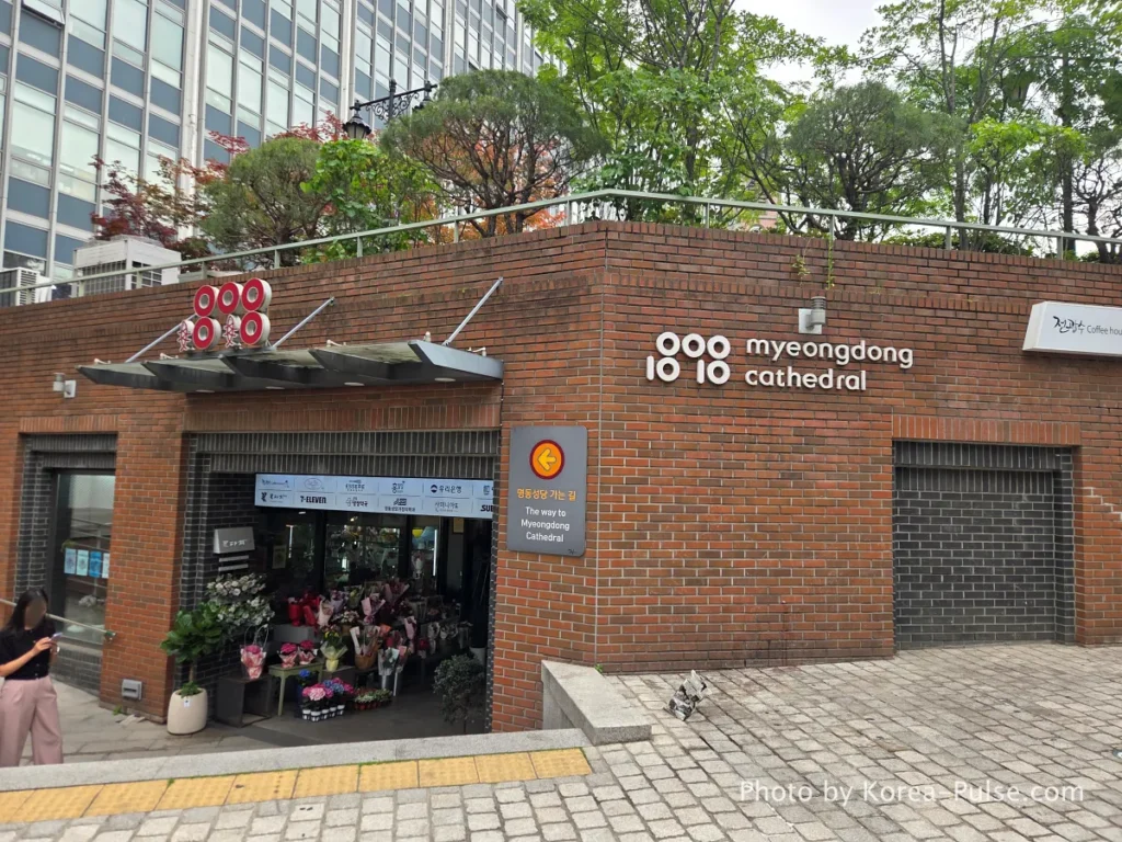 Myeongdong Cathedral: Seoul's Gothic Soul, Hidden Above the Shopping District 2 Entrance to 1898 Plaza beneath Myeongdong Cathedral — modern brick corridor passageway from Euljiro direction