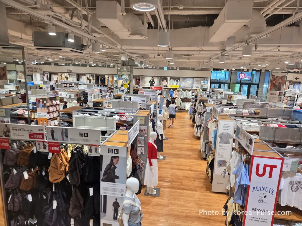 DUNDUN Dongdaemun: 8 Floors, Zero Excuses to Shop Anywhere Else 8 Uniqlo store interior at DUNDUN Dongdaemun 1st floor showing UT graphic tees blazers and full collection