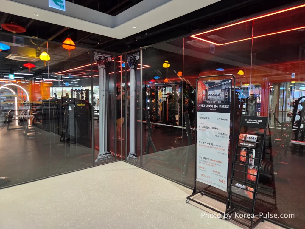 DUNDUN Dongdaemun: 8 Floors, Zero Excuses to Shop Anywhere Else 22 Shamani Gym fitness center entrance at DUNDUN Dongdaemun 6th floor with Roman column interior design and red neon lighting