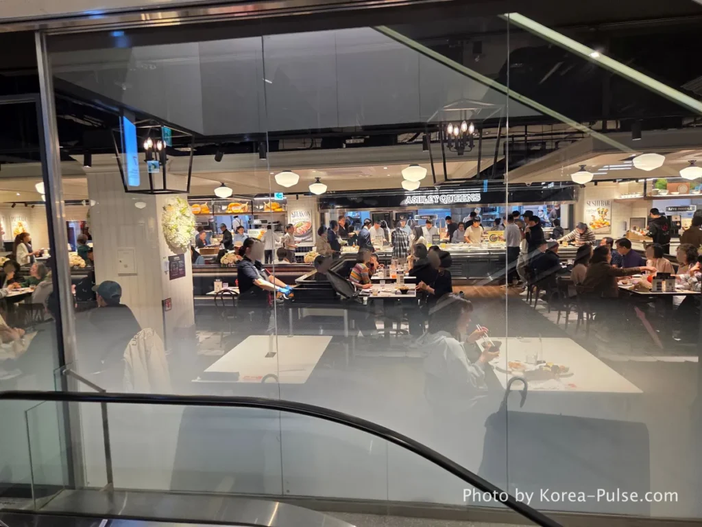 DUNDUN Dongdaemun: 8 Floors, Zero Excuses to Shop Anywhere Else 24 Ashley Queens family buffet restaurant entrance and crowded packed dining hall on 7th floor DUNDUN Dongdaemun