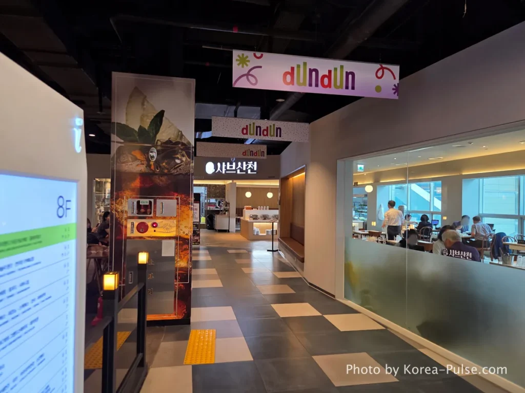 DUNDUN Dongdaemun: 8 Floors, Zero Excuses to Shop Anywhere Else 26 8th floor restaurant area and colorful neon claw machine Ppobgi arcade at DUNDUN Dongdaemun Seoul