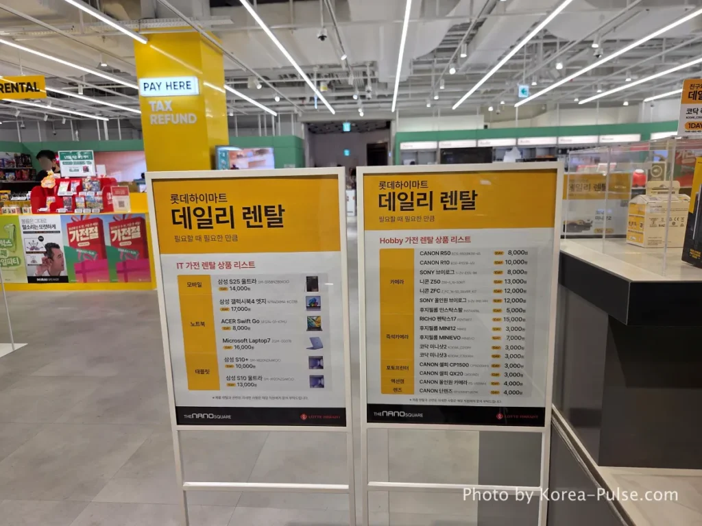 DUNDUN Dongdaemun: 8 Floors, Zero Excuses to Shop Anywhere Else 31 Daily Rental pricing board at DUNDUN Dongdaemun showing 2026 daily rental fees for cameras lenses laptops and electronics