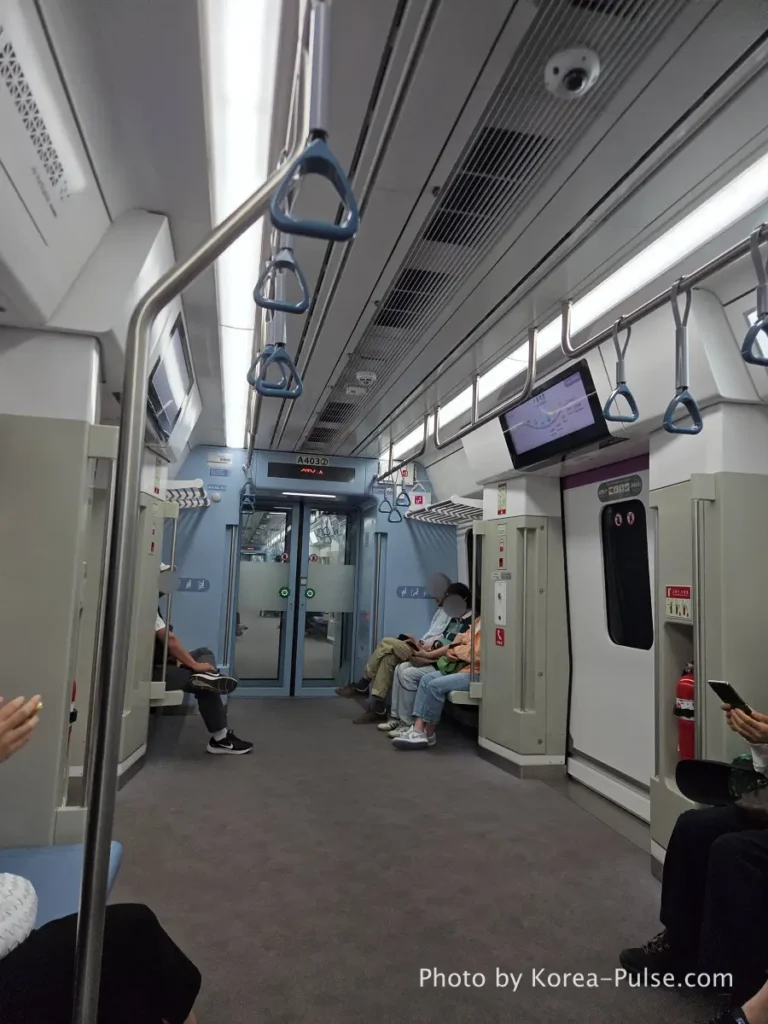 GTX-A Seoul Guide: Korea's Deep Underground Express from Daegok to Seoul Station 7 Spacious interior view of the GTX-A express train cabin with comfortable blue handles