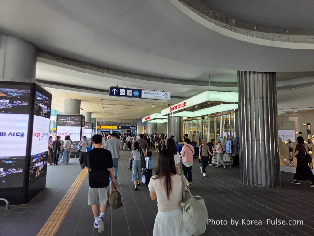 GTX-A Seoul Guide: Korea's Deep Underground Express from Daegok to Seoul Station 14 Seoul Station plaza ground level with Lotte Outlets and crowds of weekend travelers