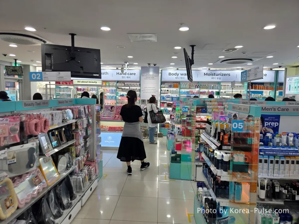 Crowded beauty products display aisles on 2nd floor Daiso Myeongdong Station branch Seoul