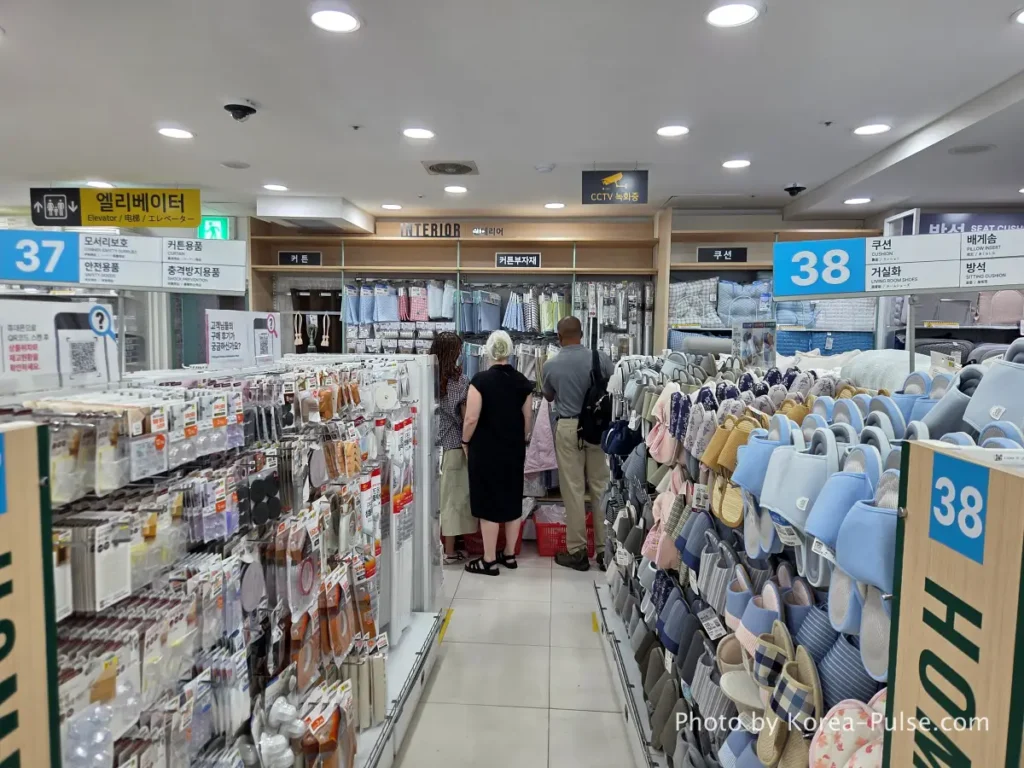 Interior section curtains cushions and indoor slippers display on 7th floor Daiso Myeongdong Station branch Seoul