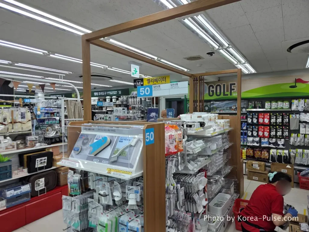 Golf accessories and sports equipment display on 9th floor Daiso Myeongdong Station branch Seoul