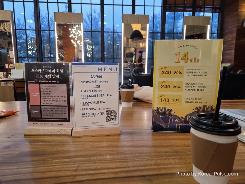 Beverage menu and coffee served to clients at idHAIR One Mount Korean hair salon