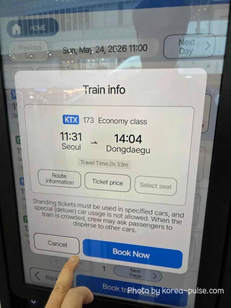 How to Buy a KTX Ticket at Seoul Station: A Friendly Step-by-Step Guide for Foreigners 6 Train info pop-up on the KTX ticket machine showing KTX 173 Economy Class departing Seoul at 11:31 and arriving Dongdaegu at 14:04 with a Book Now button at the bottom