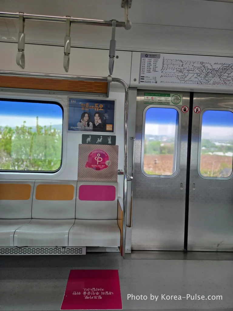 KTX Korea: A 600km Day Trip That Turned Distance into Family Time 1 Pink carpet priority seating on Seoul Metro subway for pregnant women
