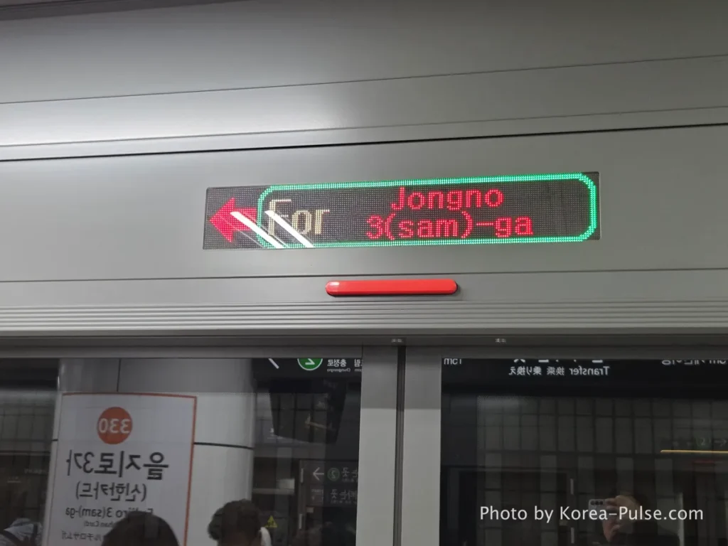 Inside Seoul Rush Hour: Why Korea's Subway System Feels Different 3 LED destination sign on Seoul Metro displaying For Jongno 3(sam)-ga in English with directional arrow