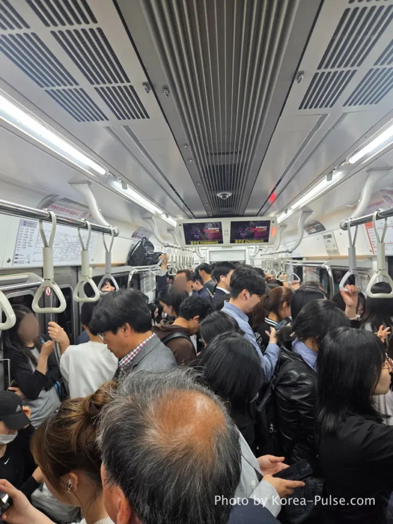 Inside Seoul Rush Hour: Why Korea's Subway System Feels Different 7 Crowded Seoul Metro Line 3 train packed with standing passengers during rush hour commute