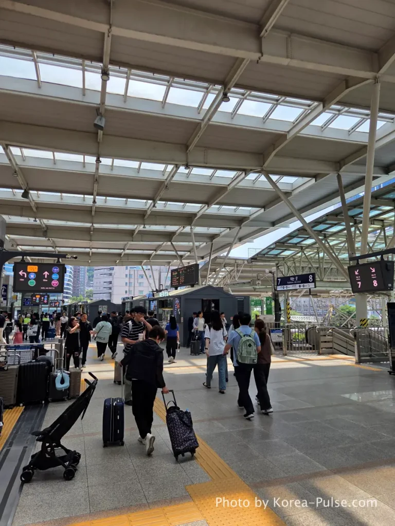 Seoul Station KTX concourse corridor with kiosks and snack stalls before Platform 10