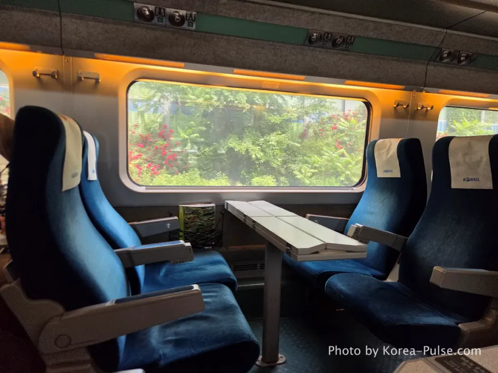 KTX companion seat quad layout seats facing each other with shared table on KTX family trip Korea