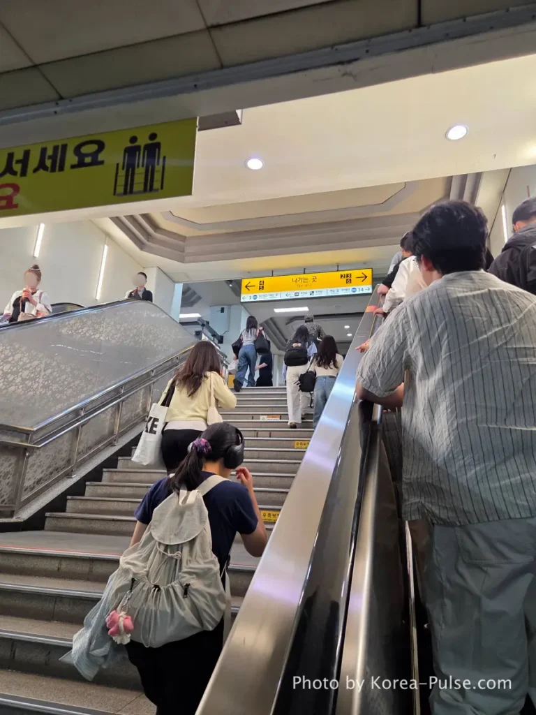 Escalator rising to Dongdaegu Station main hall from platform level