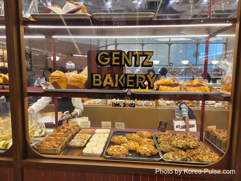 Dongdaegu to Andong Train: Riding Korea's Classic Mugunghwa 2 Gentz Bakery display case croissants pastries Shinsegae Department Store Dongdaegu basement food court