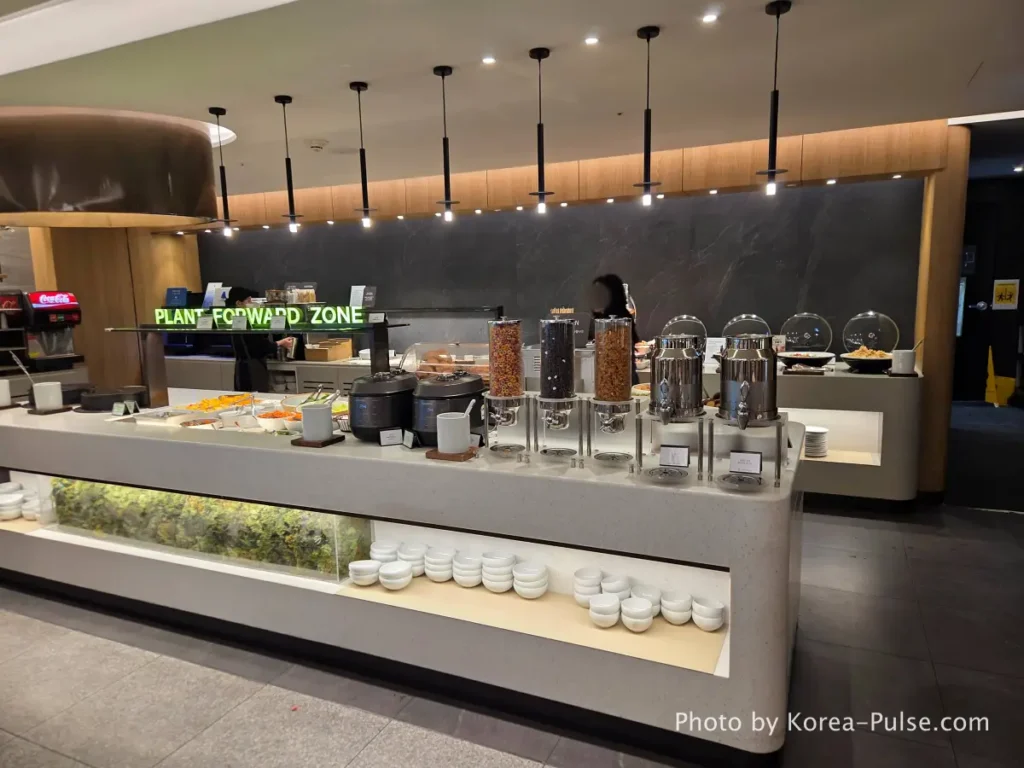 Incheon Airport Smartpass: Skip the Line & Hit the Lounge Fast 12 SKYHUB Lounge Incheon Airport Terminal 1 interior buffet area with clean layout and food stations