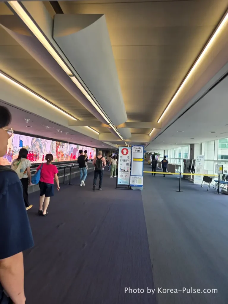Incheon Airport Arrival Guide: Plane to Bus in Under an Hour 4 Incheon Airport quarantine checkpoint corridor split showing immigration left and health screening right at Terminal 1