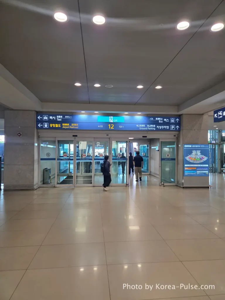 Korea Transit Guide: Incheon Airport arrivals hall showing public transportation signs and airport bus information