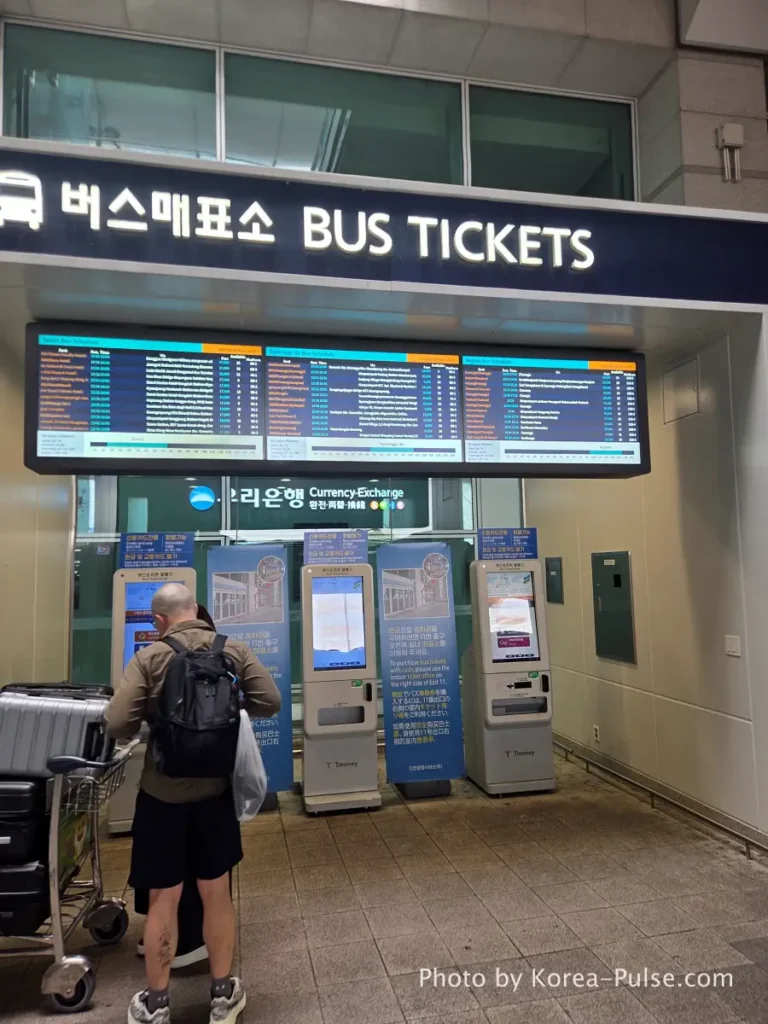 Incheon Airport Arrival Guide: Plane to Bus in Under an Hour 13 BUS TICKETS signage at Incheon Airport Terminal 1 with automated kiosk machines in the foreground