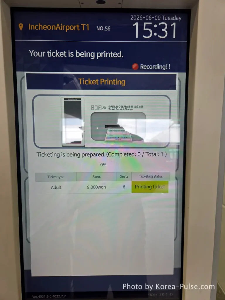 Incheon Airport Arrival Guide: Plane to Bus in Under an Hour 21 Airport bus ticket kiosk printing screen showing ticket being dispensed at Incheon Airport