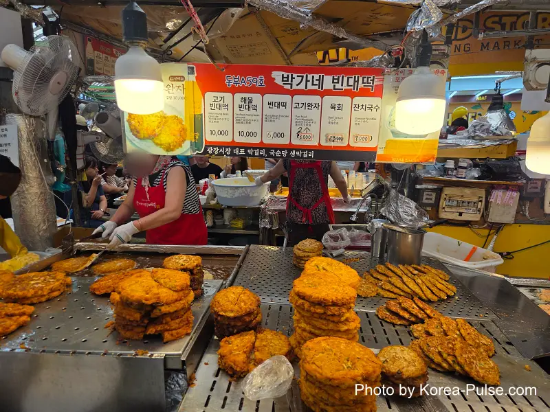 Gwangjang Market bindaetteok price menu board 6000 to 10000 won food alley stall