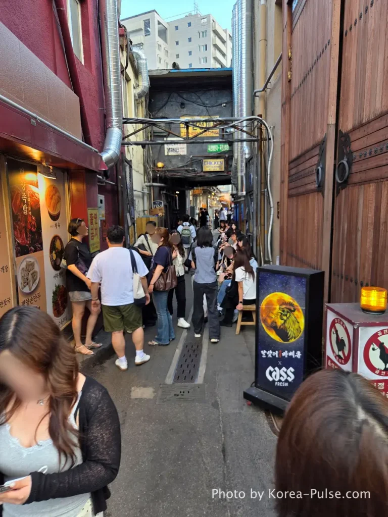 Euljiro Outdoor Dining: TOP 5 Where Seoul's Office Workers Actually Go 1 Euljiro outdoor dining Dalmaji Plaza BBQ entrance alley packed with people waiting in line Hipjiro Seoul