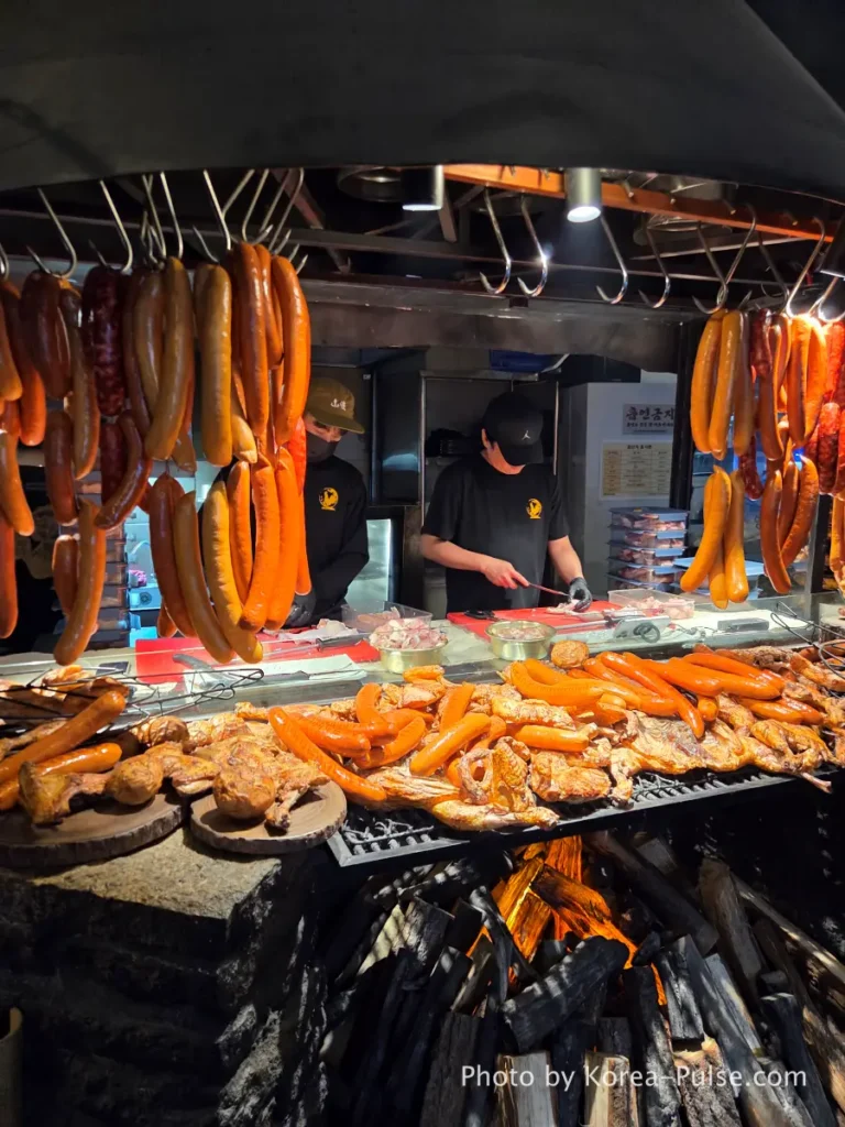 Euljiro Outdoor Dining: TOP 5 Where Seoul's Office Workers Actually Go 3 Dalmaji Plaza BBQ hanging sausages charcoal fire chicken Euljiro yajangs Seoul