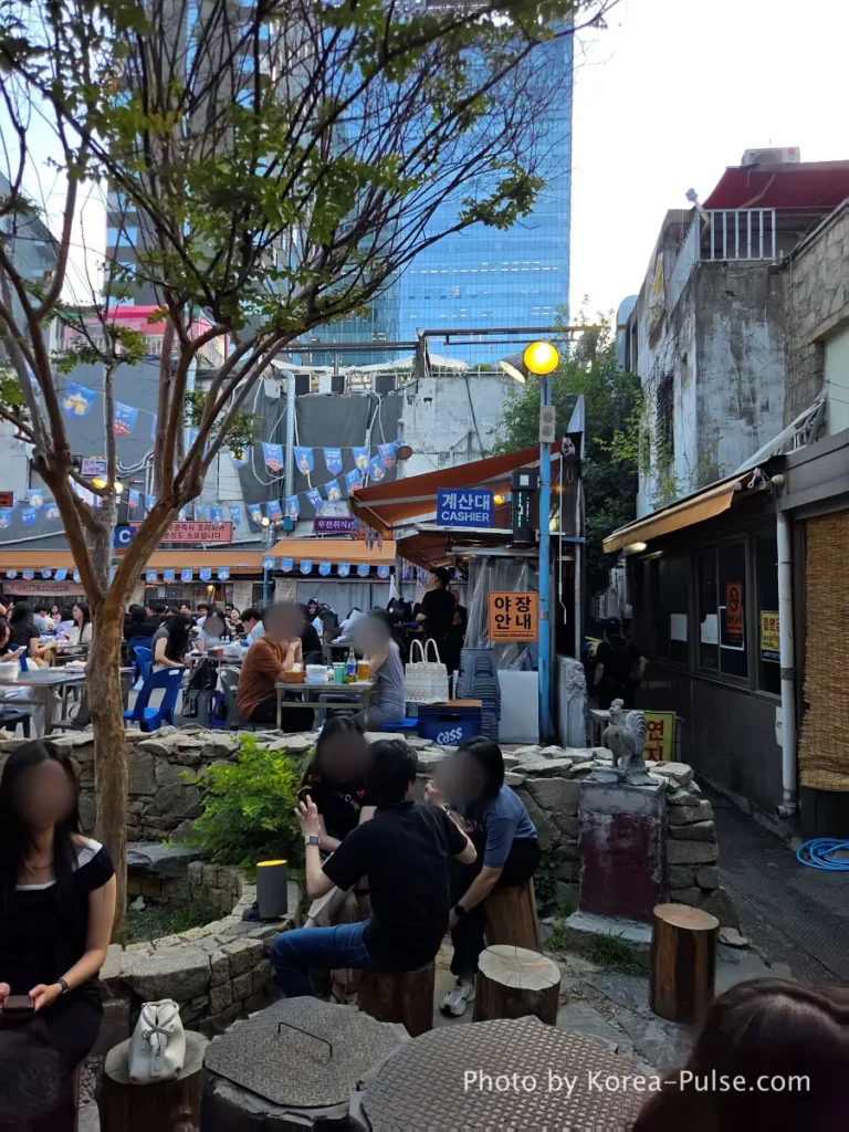 Euljiro Outdoor Dining: TOP 5 Where Seoul's Office Workers Actually Go 5 Dalmaji Plaza BBQ outdoor yajang area Seoul with cashier sign and pick-up zone