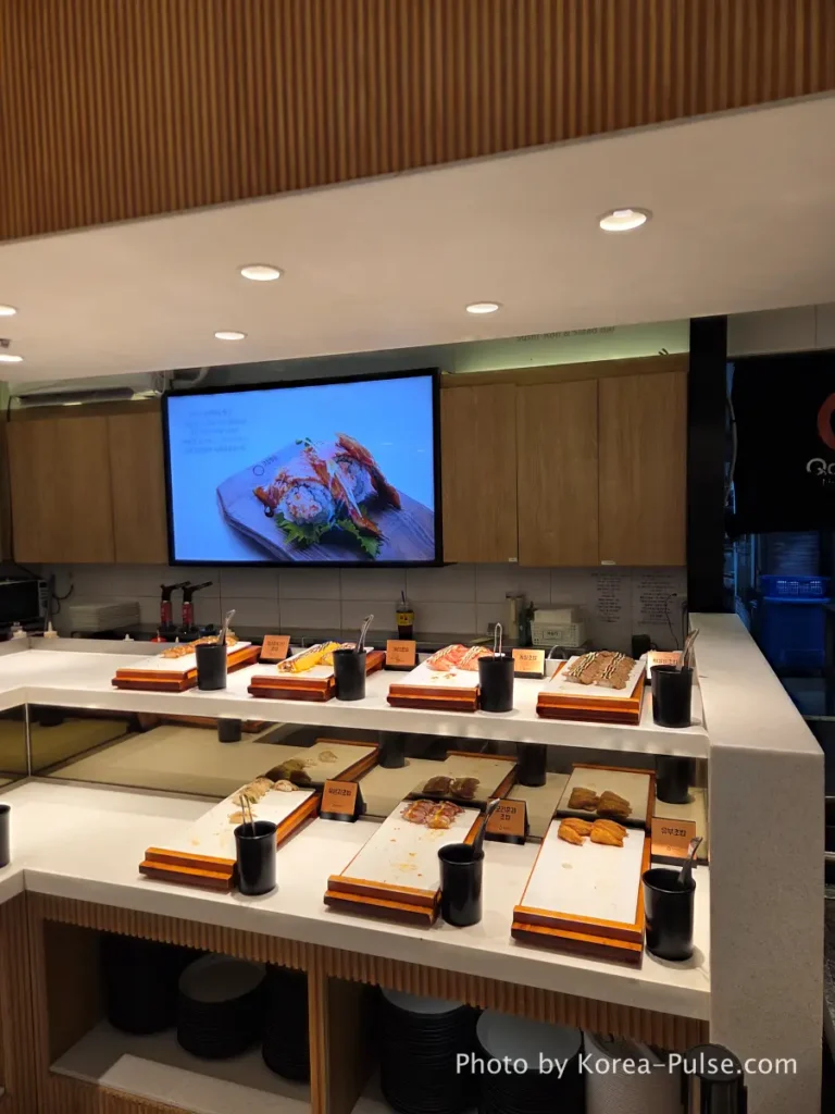 Sushi zone with inari smoked duck and egg sushi trays at QooQoo