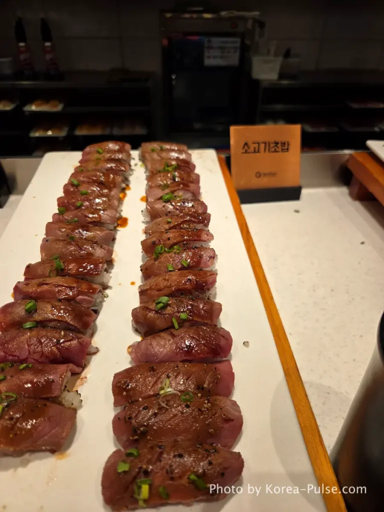 Beef sushi rows with scallion topping at QooQoo buffet