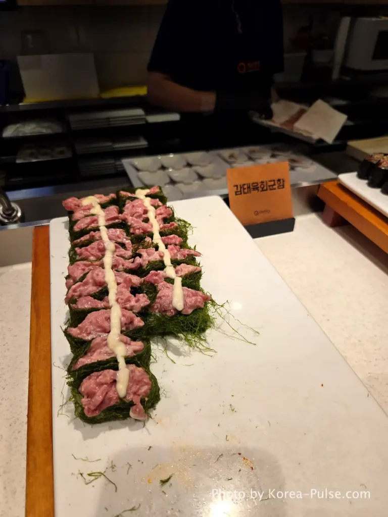 Gamtae yukhoe gunkan with seasoned raw beef on seaweed at QooQoo