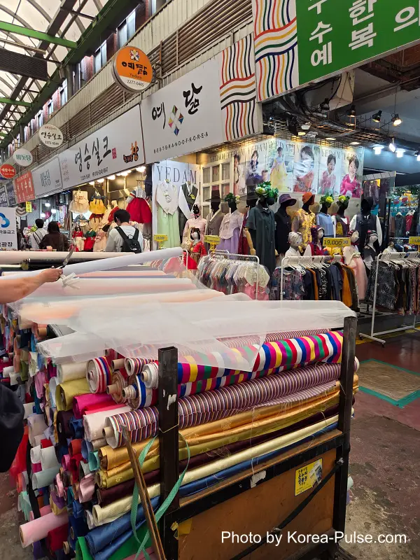 Colorful silk fabric bolts Gwangjang Market hanbok alley