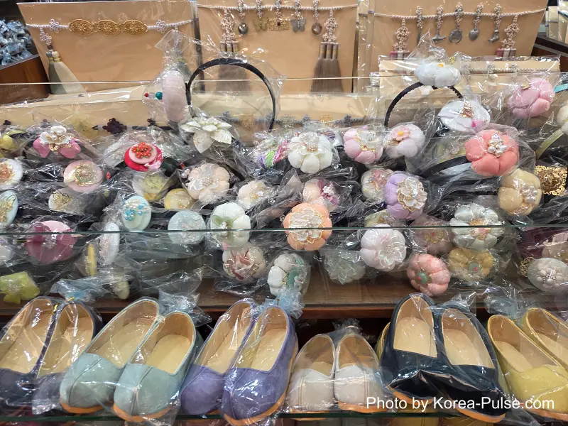 Children's gomusin shoes and floral headbands Gwangjang Market hanbok alley