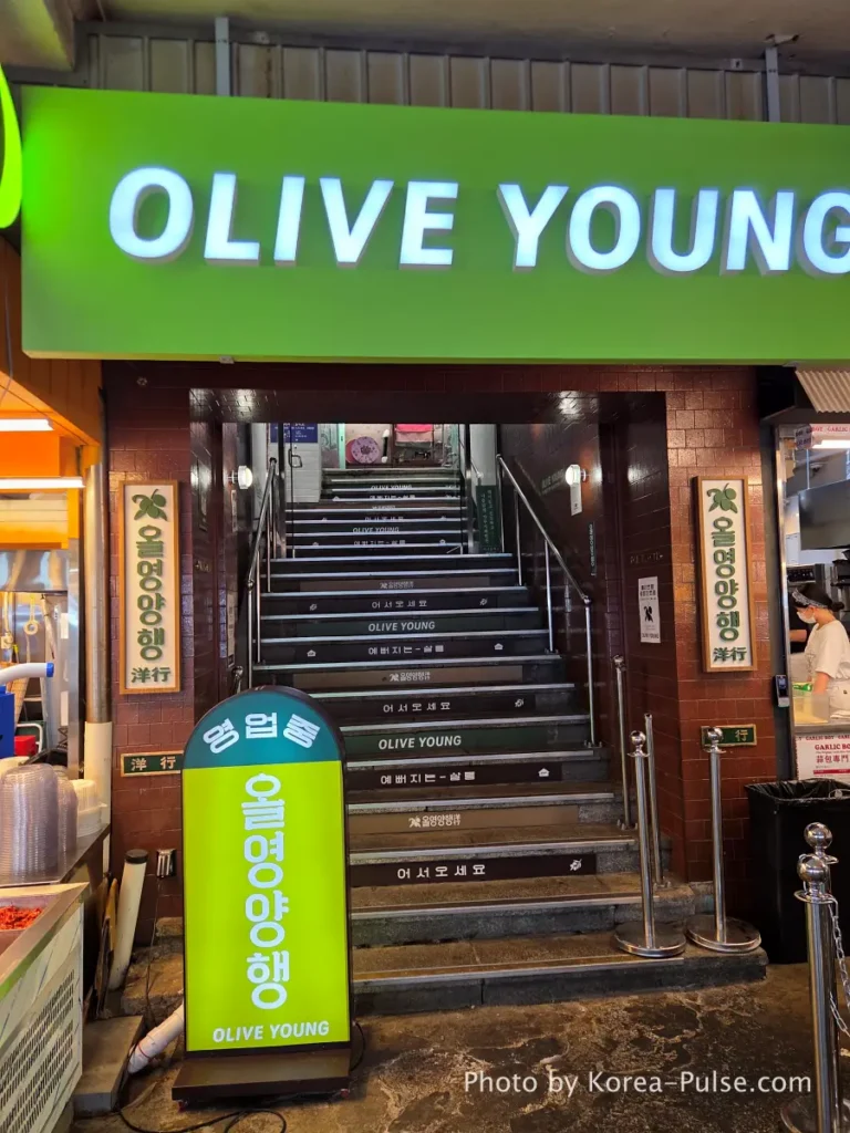 Olive Young Gwangjang Market: The Retro K-Beauty Store Hiding Inside a Century-Old Market 1 Olive Young Gwangjang Market entrance staircase sign, Seoul