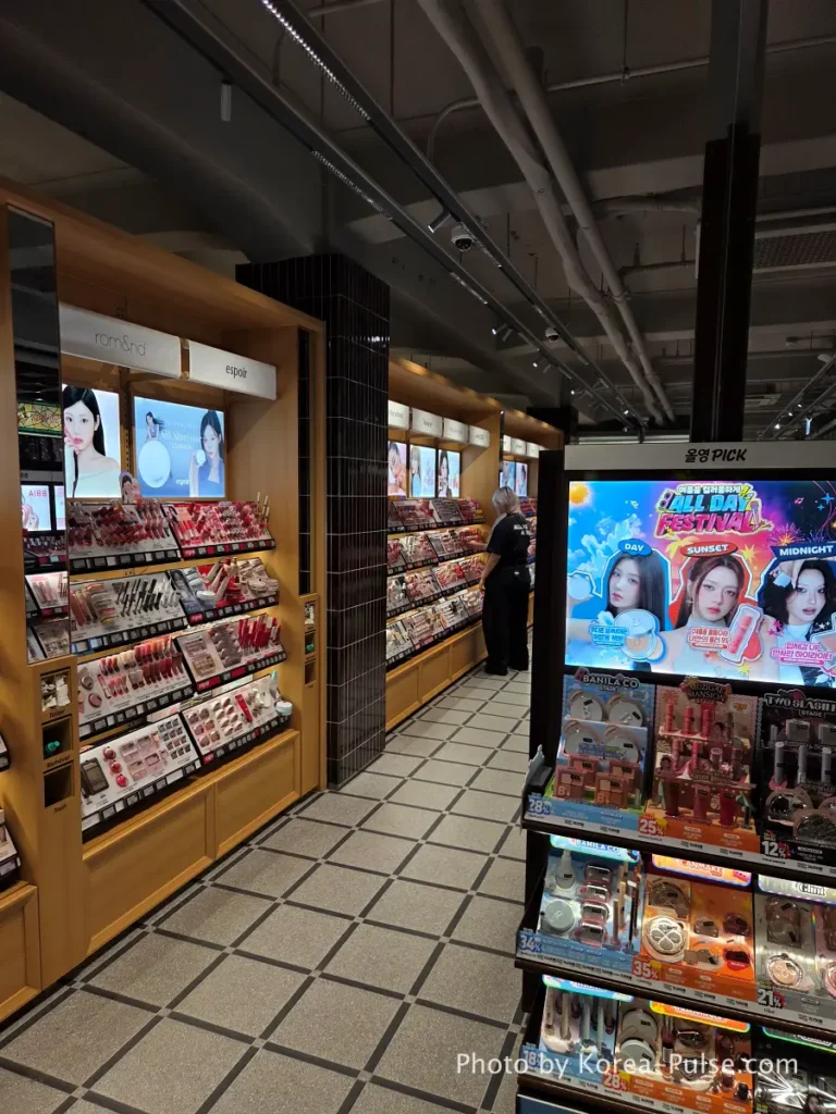 Olive Young Gwangjang Market: The Retro K-Beauty Store Hiding Inside a Century-Old Market 5 Cosmetics aisles and staff at Olive Young Gwangjang Market Seoul