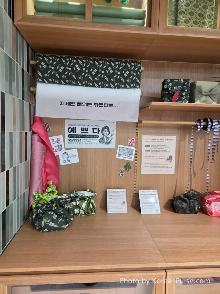 Olive Young Gwangjang Market: The Retro K-Beauty Store Hiding Inside a Century-Old Market 8 Free Bojagi wrapping cloths on display at Olive Young Gwangjang Market