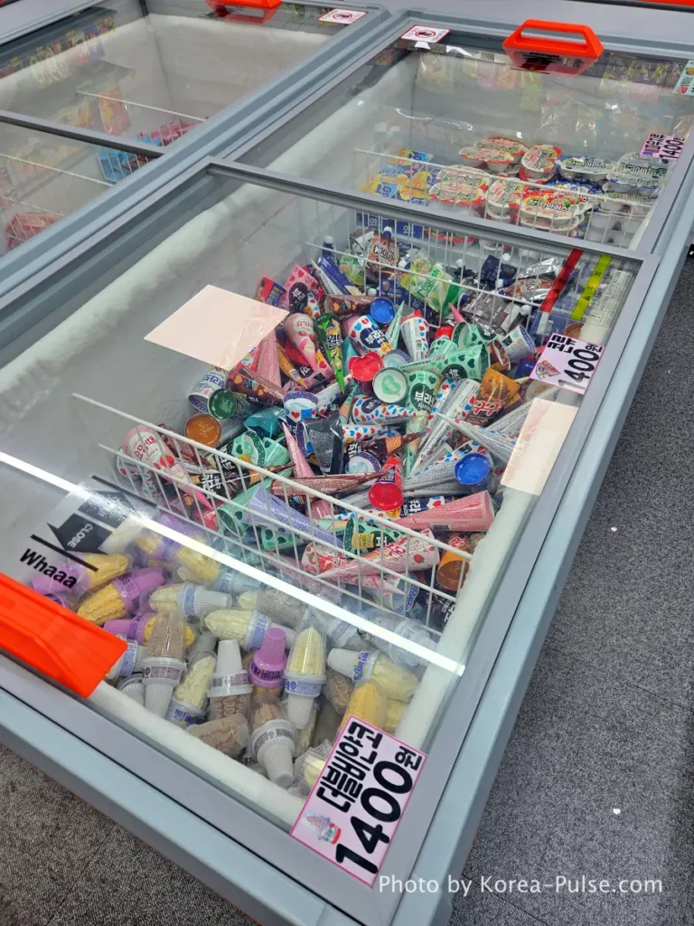 Unmanned Ice Cream Store Korea: Stunning 314% Retail Boom (2026) 6 📁 20260716_222112.webp · ALT: Freezer bin of 1,400-won cone ice cream including Bravo Cone and World Cone