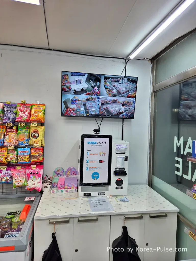 Unmanned Ice Cream Store Korea: Stunning 314% Retail Boom (2026) 8 Unmanned payment kiosk and snack shelf inside a Korean ice cream discount store