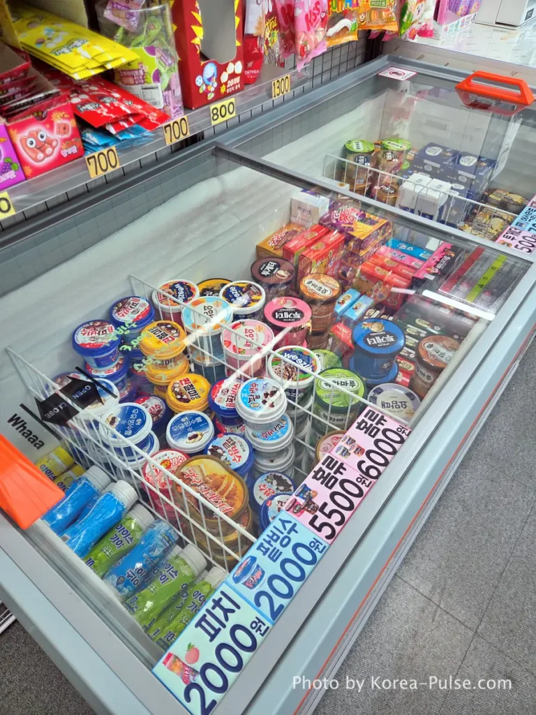 Unmanned Ice Cream Store Korea: Stunning 314% Retail Boom (2026) 7 Family-size tubs of Together and Hodu Maru ice cream priced 5,500 to 6,000 won