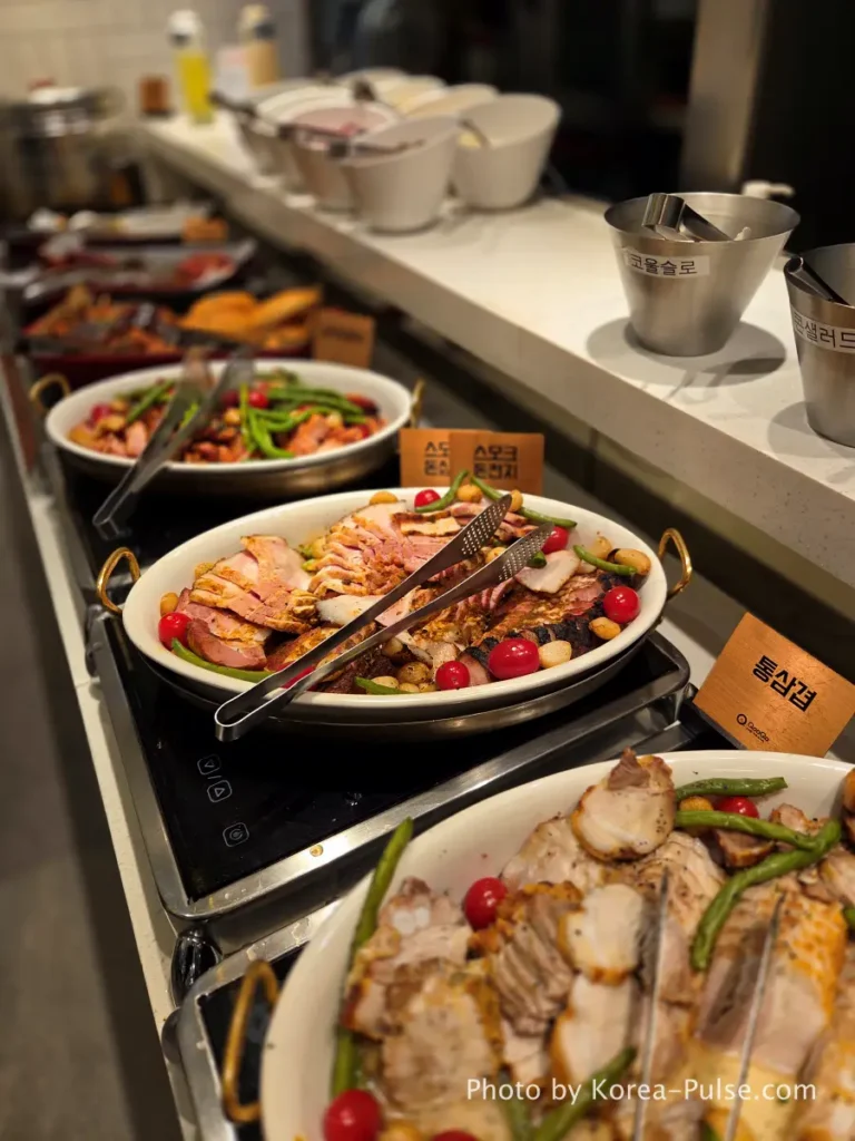 Smoked pork shoulder and pork belly plated at QooQoo Korean BBQ zone