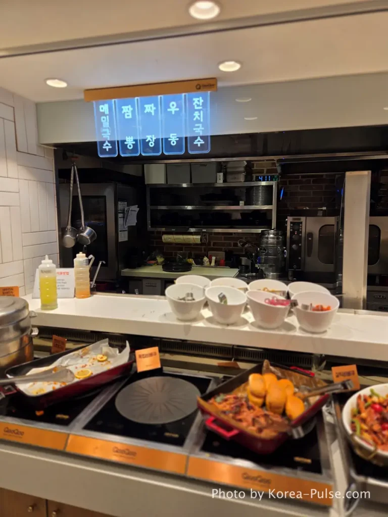 Noodle station with Korean-only menu signs at QooQoo buffet